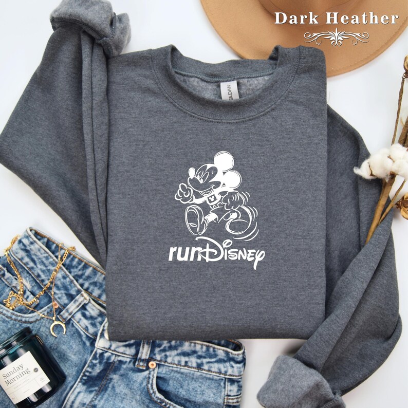 May include: A dark heather grey sweatshirt with a white graphic of Mickey Mouse running and the text "runDisney".