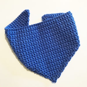 May include: A blue crocheted triangle scarf. The scarf is made with a single crochet stitch and has a simple, classic design.