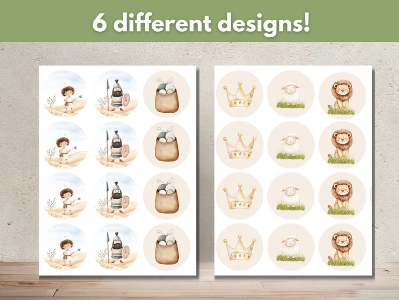 May include: Two sheets of paper with 6 different designs of round stickers. The designs include a lion, a crown, a sheep, a basket of eggs, a knight, and a knight with a shield. The text "6 different designs!" is at the top of the page.