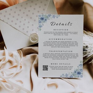 May include: Wedding details card with blue floral accents. The card includes information about the reception, accommodation, and transportation. The card also has a QR code to RSVP and a website address.