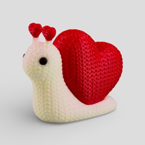 A white and red heart-shaped object is depicted in the image.