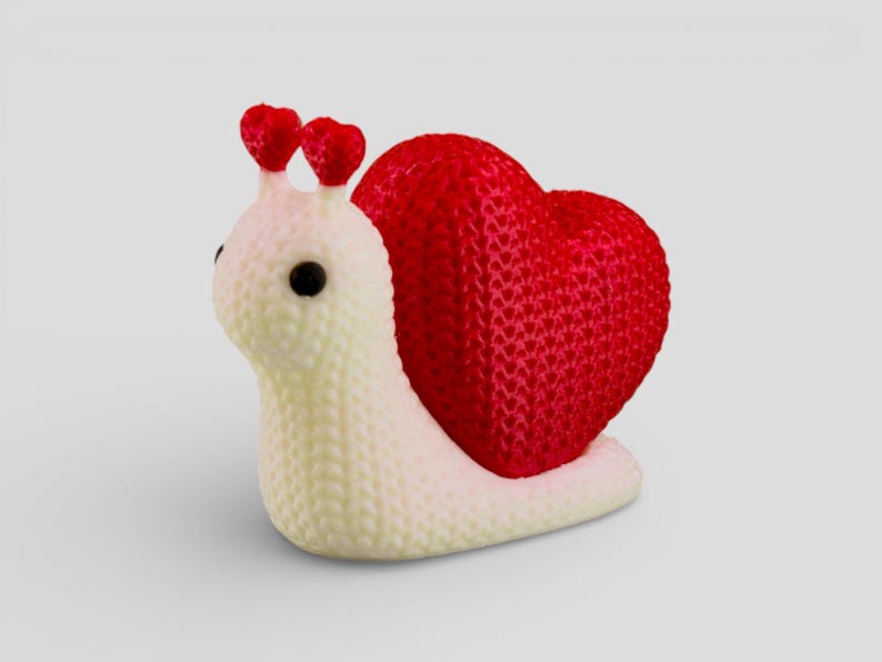 A white and red heart-shaped object is depicted in the image.