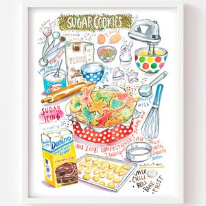 May include: A framed watercolor print titled "Sugar Cookies" featuring baking ingredients and tools. The image includes flour, sugar, eggs, a mixer, and a bowl of colorful cookies. The print also shows a box of confectioners sugar and instructions.