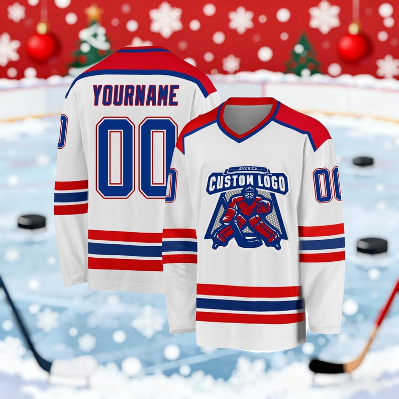 May include: White hockey jersey with red and blue accents. The jersey features the text "YOURNAME" and the number "00" on the back. The front displays a logo with the text "CUSTOM LOGO" and a hockey goalie graphic. The sleeves have red and blue stripes.