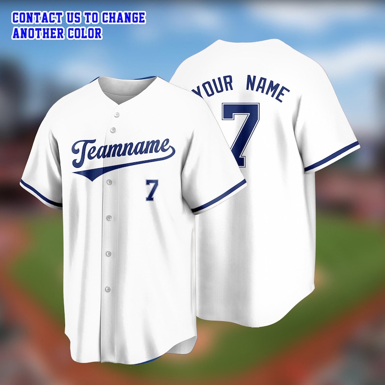 May include: White baseball jersey with navy blue accents. The jersey features the text "Teamname" and the number "7" on the front, and "YOUR NAME" and the number "7" on the back. The text "CONTACT US TO CHANGE ANOTHER COLOR" is at the top.