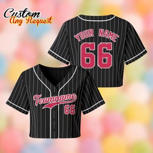 May include: Black and white striped baseball jersey with white trim. The jersey has a V-neck and buttons down the front. The text "Teamname" and the number "66" are on the front. The back of the jersey has the text "Your Name" and the number "66". The words "Custom Any Request" are in the top left corner.