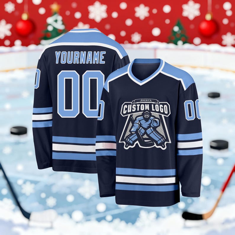 May include: Navy blue hockey jersey with light blue and white accents. The jersey features the text "YOURNAME" and the number "00" on the back. The front displays a custom logo with a goalie graphic. The jersey is designed for ice hockey.