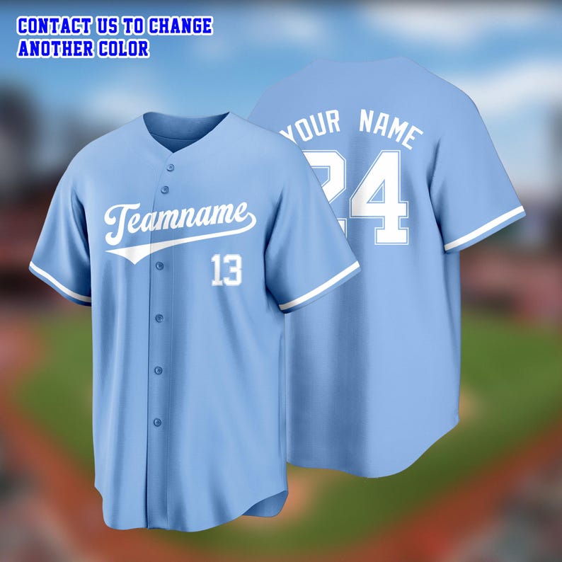 May include: Light blue baseball jersey with white accents. The front features the word "Teamname" and the number 13 in white. The back displays "Your Name" and the number 24. The text "CONTACT US TO CHANGE ANOTHER COLOR" is at the top.