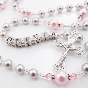 Light Gray and Pink rosary with a name in the middle of the third decade. Baptism or First Communion gift for a girl.