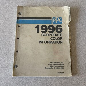 May include: A beige, three-hole punched PPG 1996 Corporate Color Information manual with blue and black horizontal stripes. The cover features the text 1996 CORPORATE COLOR INFORMATION, PPG logo, and address details for PPG Industries, Inc. in Strongsville, OH.