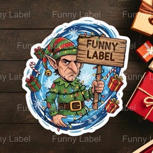 May include: A sticker featuring a cartoon elf holding a wooden sign that reads "FUNNY LABEL." The elf is dressed in a green and red outfit with Christmas lights and a gold belt buckle. The background includes snowflakes and gift boxes.