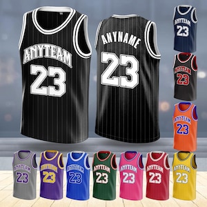 May include: Black and white basketball vest with the text "ANYTEAM" and the number "23". The vest has vertical stripes. Additional vests in various colours are displayed, with the text "60 COLOR OPTIONS".