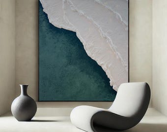 May include: A modern living room interior with a white and teal abstract painting hanging on the wall. A white and gray lounge chair sits in front of the painting. A gray ceramic vase sits on the floor.
