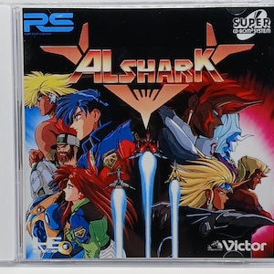 May include: A video game cover for the Super CD-ROM System. The cover features a colorful illustration of a group of characters in a futuristic setting. The title of the game is "ALSHARK" and the logo for Victor Interactive Software is in the bottom right corner.