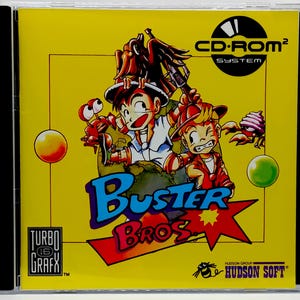 May include: A yellow CD-ROM case featuring the game "Buster Bros." The cover art depicts two cartoon characters with weapons, surrounded by cartoon creatures. The game title is in blue and red, with the TurboGrafx-16 and Hudson Soft logos.