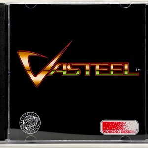 May include: A black CD case featuring the game title "Vasteel" in a stylized orange and green font. The case includes logos for "Turbo Grafx" and "Working Designs". The CD case is encased in a clear plastic jewel case.
