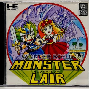 May include: A CD case featuring the game "Wonder Boy III: Monster Lair." The cover art depicts two cartoon characters, a boy with a sword and a girl with a staff, set against a backdrop of a dragon and a tropical scene. The game title is prominently displayed.