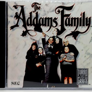 May include: The Addams Family TurboGrafx 16 video game case. The cover features the Addams Family characters in front of a marble-like background. The game's title is in a black, gothic font. The NEC and TurboGrafx logos are visible.