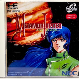 May include: A video game case for the PC Engine Super CD-ROM2 system titled Metamor Jupiter. The cover features an illustration of a character with long blue hair wearing a green top against a backdrop of the planet Jupiter and space.