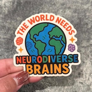 May include: A sticker with the text "THE WORLD NEEDS NEURODIVERSE BRAINS" in orange, blue, and white. The design includes a globe with green continents and blue oceans, surrounded by orange stars and purple brain illustrations.