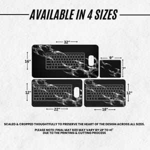 May include: A set of four black desk mats with a white abstract smoke pattern, labeled AVAILABLE IN 4 SIZES. Dimensions shown are 32x16 inches, 9x7 inches, 22x12 inches, and 18x12 inches. Text states: SCALED & CROPPED THOUGHTFULLY TO PRESERVE THE HEART OF THE DESIGN ACROSS ALL SIZES. PLEASE NOTE: FINAL MAT SIZE MAY VARY BY UP TO &plusmn;1 INCH DUE TO THE PRINTING & CUTTING PROCESS.