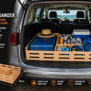 May include: A wooden trunk organizer with multiple compartments, shown inside a car trunk. The organizer is 39.37 inches long, 37.4 inches wide, and 7.87 inches high. The trunk contains a blue suitcase, a hat, and various travel items.