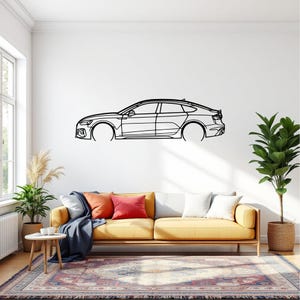 May include: A black metal wall art piece depicting the side profile of a car. The artwork is a minimalist line drawing, showcasing the car's silhouette against a white wall. The car's design includes details of the headlights, wheels, and rear.