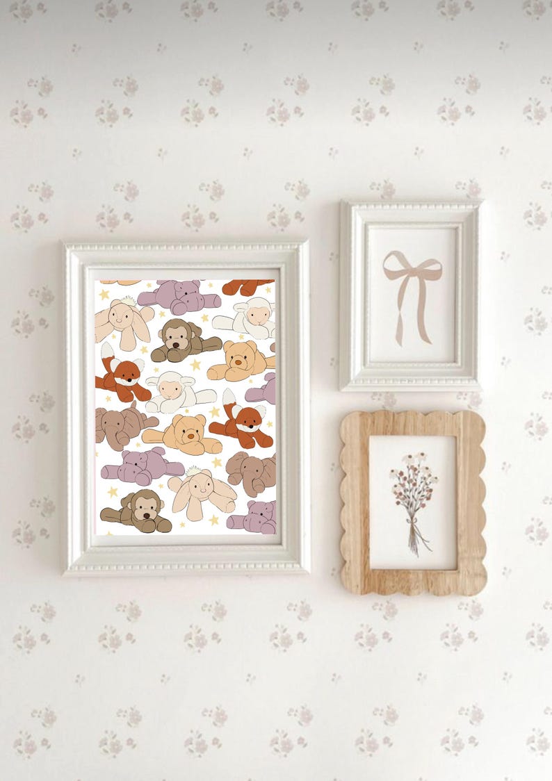 May include: A white framed print with a white background and a pattern of colorful stuffed animals. The animals include a fox, a bear, a monkey, a lamb, a hippopotamus, and a bunny. The print is surrounded by a white wall with a floral pattern.