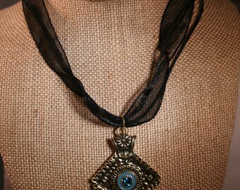 Black Necklace with Blue Centered Ornate Pendant