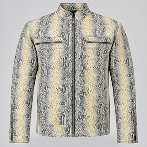 May include: A long-sleeve jacket featuring a snakeskin pattern in shades of cream, yellow, and charcoal gray. The garment includes a full-length front zipper, a stand-up collar, two horizontal zippered chest pockets, and zippered sleeve cuffs.