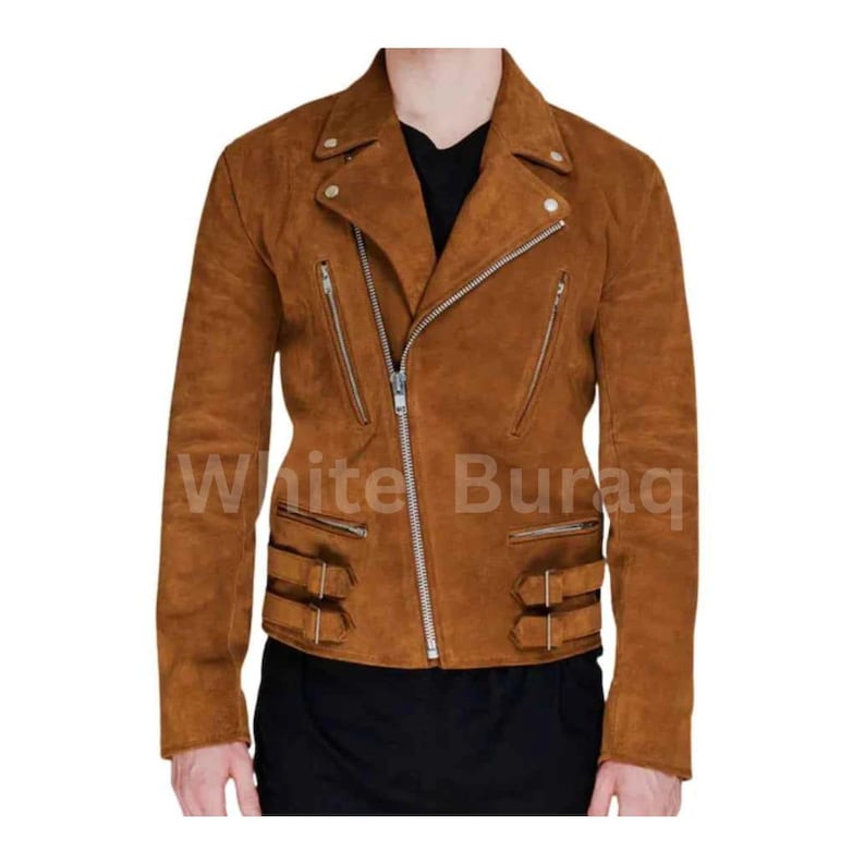 May include: A brown suede motorcycle jacket with a notched collar, multiple zippered pockets, and silver hardware. The jacket features a diagonal zipper closure and buckle details at the waist. The text "White Buraq" is visible on the jacket.