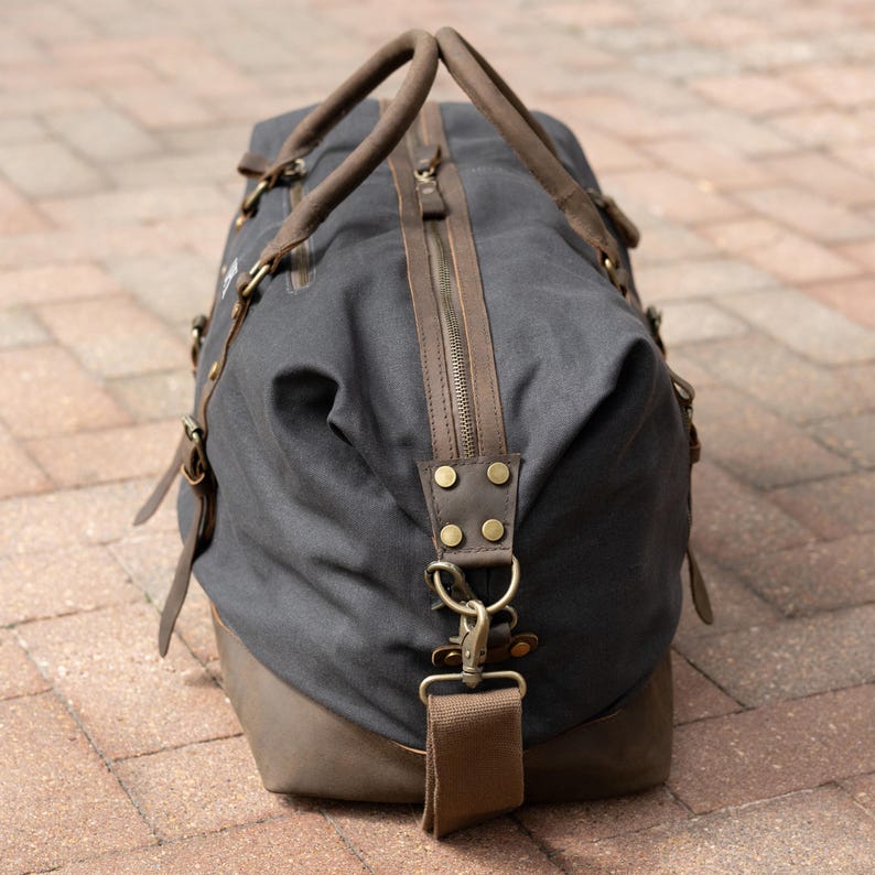 Side-view of the charcoal grey langston duffle bag