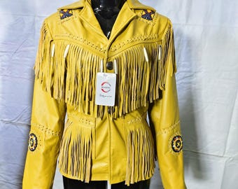 May include: Mustard yellow leather jacket with fringe detailing across the chest and sleeves. The jacket features decorative beading on the shoulders and sleeves, and a tag that reads "MAXING".