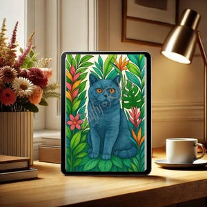 May include: A blue British Shorthair cat sitting in a lush tropical jungle setting. The cat is surrounded by green leaves, pink flowers, and orange flowers. The cat is looking directly at the viewer.