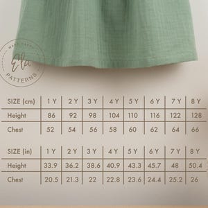 May include: A sage green garment, possibly a dress or top, is displayed. A size chart in inches and centimeters is visible, detailing height and chest measurements for children aged 1 to 8 years old. The Ela Patterns logo is in the upper left corner.