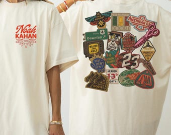 ノア・カーン「ザ・ディバイド・ツアー」Tシャツ、「ポーチライトをつけたままコンサートTシャツ」