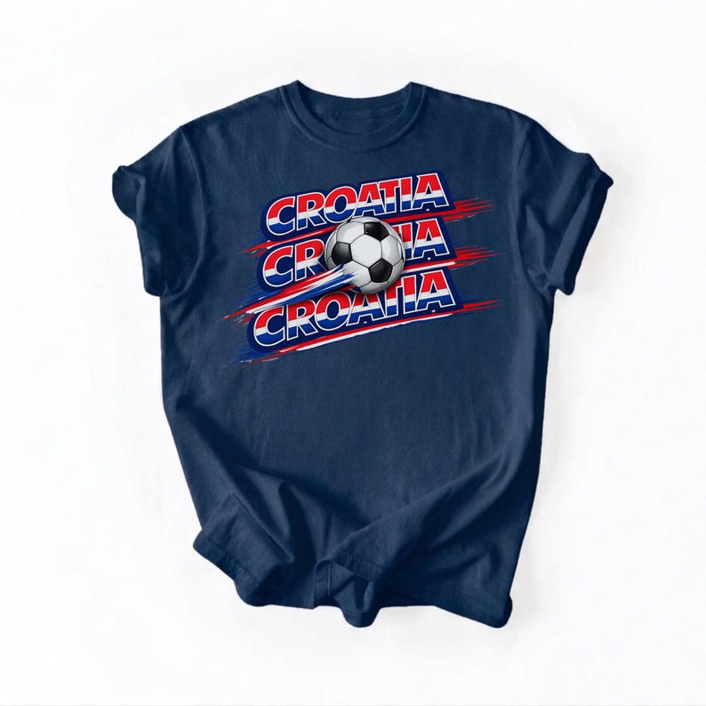 May include: Navy blue t-shirt featuring the word "CROATIA" in red, white, and blue, with a soccer ball graphic. The design includes three instances of the word "CROATIA" with a soccer ball in the center.