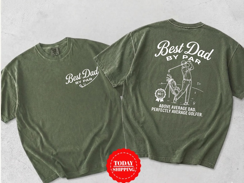 May include: An olive green short-sleeve t-shirt featuring white screen-printed graphics. The front displays the text Best Dad By Par. The back shows a golfer, a golf bag, a No. 1 badge, and the text Best Dad By Par Above Average Dad Perfectly Average Golfer.