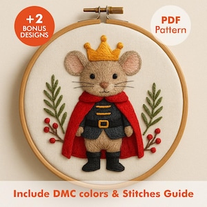 May include: Embroidered hoop art featuring a mouse dressed as a king, wearing a gold crown and red cape. The design includes green leaves and red berries. Text on the image reads "+2 BONUS DESIGNS", "PDF Pattern", and "Include DMC colors & Stitches Guide".
