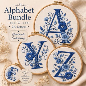 May include: An alphabet bundle of handmade embroidery featuring letters A, Y, Z, and E stitched in blue thread on white fabric within wooden hoops. The designs include floral motifs with vines and leaves. Text reads Alphabet Bundle 26 Letters.
