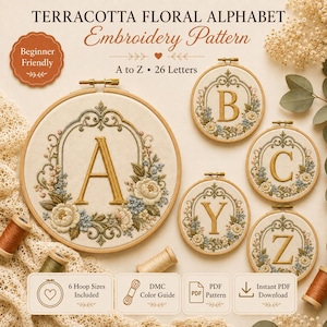 May include: A digital embroidery pattern set titled Terracotta Floral Alphabet featuring 26 letters from A to Z. The design displays gold embroidered letters framed by intricate floral wreaths in circular wooden hoops on cream fabric.
