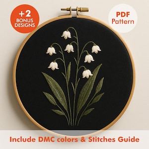 May include: An embroidery hoop with a black fabric background features a detailed floral design of white bell-shaped flowers and green leaves. The text "+2 BONUS DESIGNS" and "PDF Pattern" are visible.