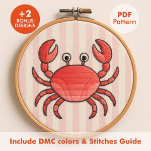 May include: A cross-stitch embroidery hoop featuring a red crab design on a pink and white striped background. The text "PDF Pattern" and "+2 Bonus Designs" are visible. The text "Include DMC colors & Stitches Guide" is also present.
