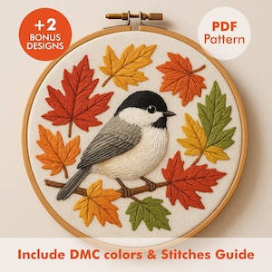 May include: Embroidered hoop art featuring a bird perched on a branch, surrounded by colorful autumn leaves. The design includes the text "+2 Bonus Designs" and "PDF Pattern". The text "Include DMC colors & Stitches Guide" is also included.