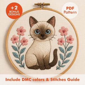 May include: A Siamese cat embroidery pattern in a wooden hoop. The cat has blue eyes and is surrounded by pink flowers and blue leaves. Text includes "+2 Bonus Designs", "PDF Pattern", and "Include DMC colors & Stitches Guide".