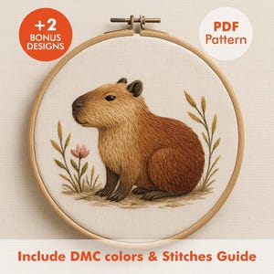 May include: An embroidery hoop with a detailed capybara design, showcasing brown and tan fur, and embroidered plants and flowers. The text "PDF Pattern" and "+2 Bonus Designs" are visible. The text "Include DMC colours & Stitches Guide" is also present.