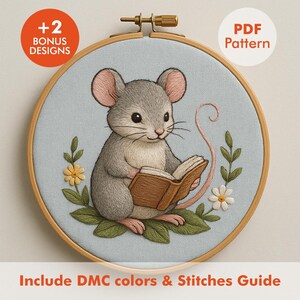 May include: A cross-stitch embroidery hoop featuring a gray mouse reading a book, surrounded by floral accents. The design includes the text "+2 BONUS DESIGNS" and "PDF Pattern". The text "Include DMC colors & Stitches Guide" is also included.