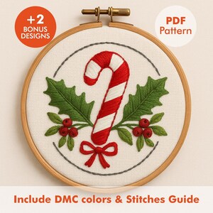 May include: Embroidered Christmas design in a wooden hoop. The design features a red and white candy cane, green holly leaves, and red berries. The text "+2 BONUS DESIGNS" and "PDF Pattern" are visible. The text "Include DMC colors & Stitches Guide" is also present.