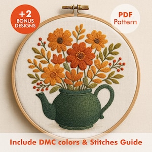 May include: Embroidered floral design in a wooden hoop. The design features orange and yellow flowers in a green teapot. The text includes "+2 BONUS DESIGNS", "PDF Pattern", and "Include DMC colors & Stitches Guide".