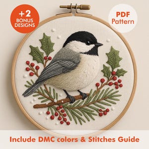 May include: Embroidered bird design in a wooden hoop. The bird is black, gray, and cream, perched on a branch with green leaves and red berries. Includes the text "+2 Bonus Designs" and "PDF Pattern". The text "Include DMC colors & Stitches Guide" is also included.